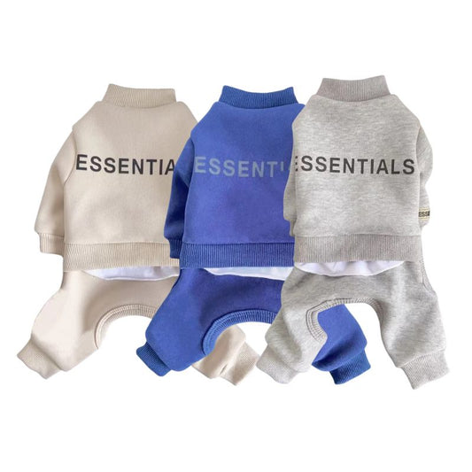 Three dog sweaters in beige, blue, and gray with 'ESSENTIALS' branding on a white background.