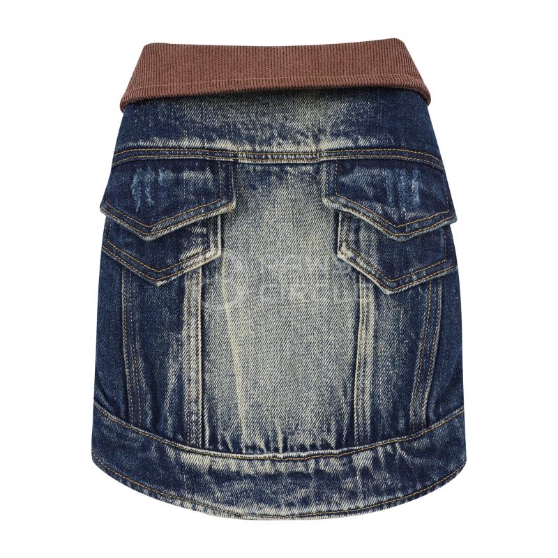 Blue denim dog jacket with brown trim on a white background