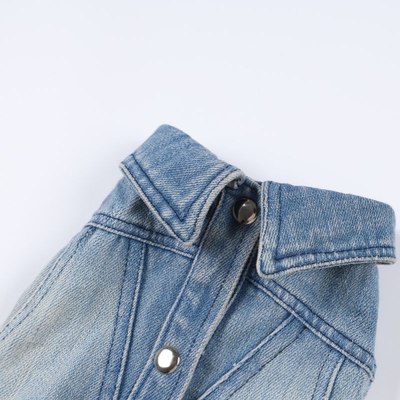Close-up of a blue denim jacket on a white background