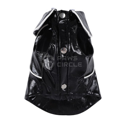 Black patent leather dog coat with white trim on a white background, branded 'Paws Circle'.