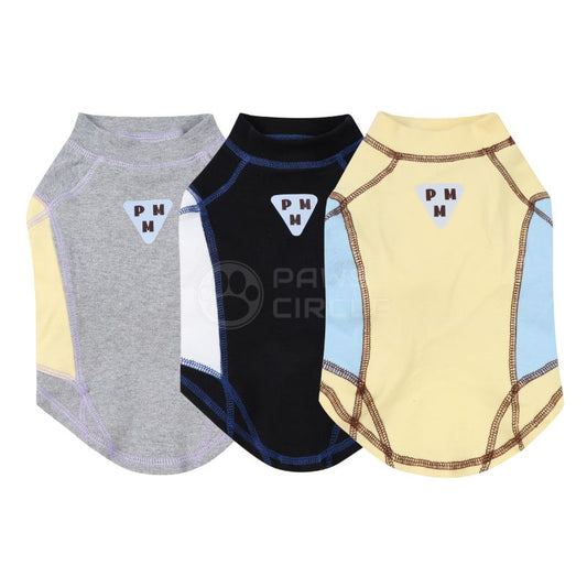 Three dog shirts in gray, black, and yellow with a logo on a white background
