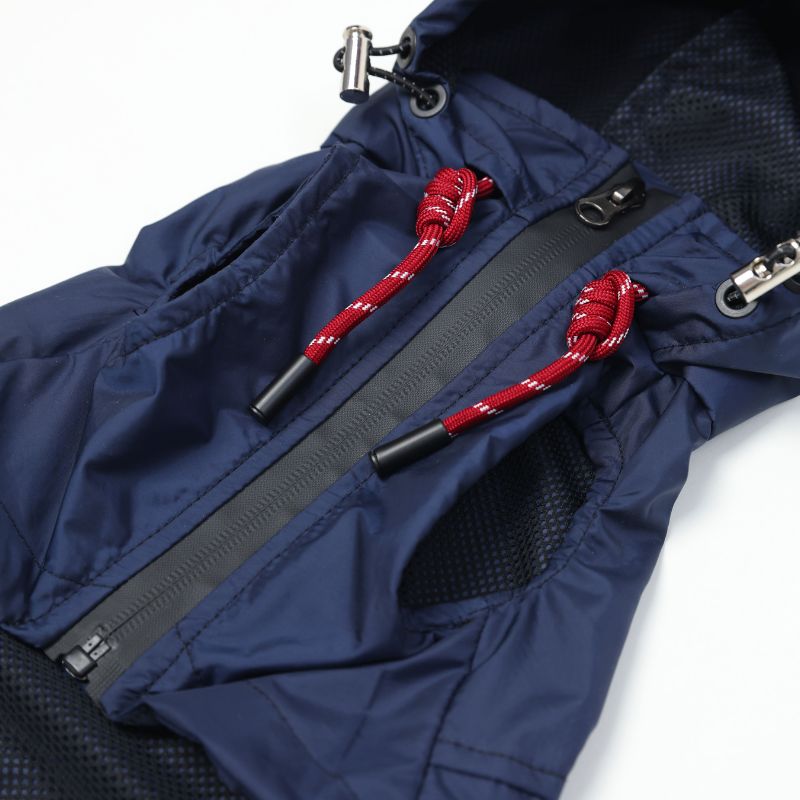 Close-up of a blue jacket with red drawstrings on a white background