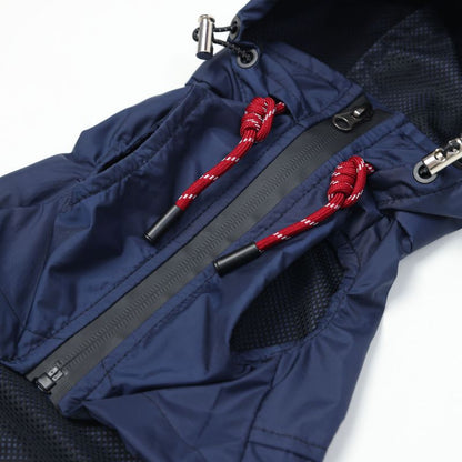 Close-up of a blue jacket with red drawstrings on a white background