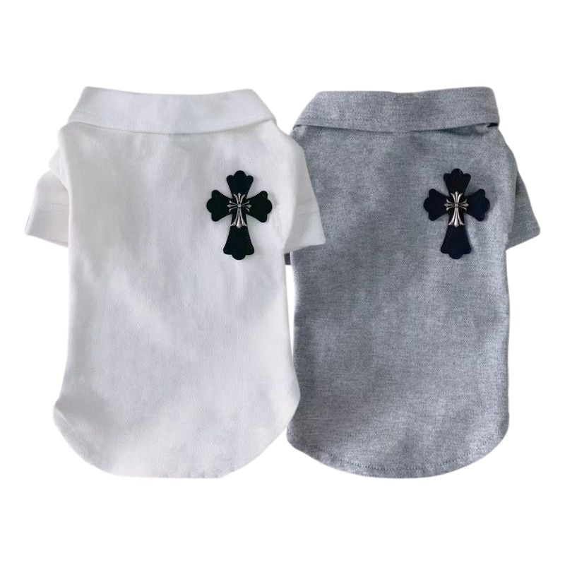 Two CHROME HEARTS POLO TEE FOR DOGS, one white and one gray, with black cross designs on a white background.