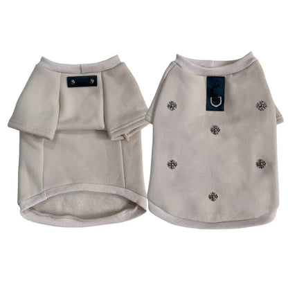 Two beige chrome hearts dog sweaters with decorative buttons on a white background