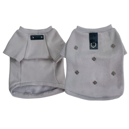 Two gray dog chrome heart sweaters with decorative cross on a white background