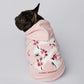 dog in offwhite hoodie