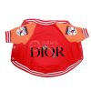 Red and orange dog jacket with 'Dior' branding on a white background