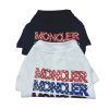 Two dog shirts with 'Moncler' branding on a white background