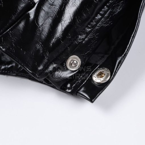 Close-up of a black leather jacket with silver buttons on a white background