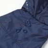 Navy blue fabric with water droplets demonstrating water resistance.