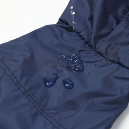 Navy blue fabric with water droplets demonstrating water resistance.