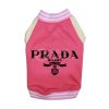 Pink dog sweater with 'Prada Milano' branding on a white background